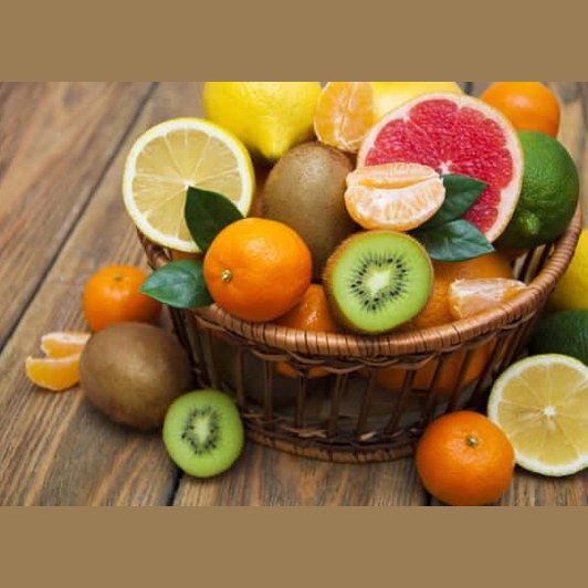 Basket of seasonal mixed fruits including citrus, kiwi, and mandarins, freshly harvested from local producers.