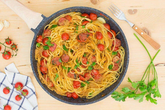 VERMICELLI MMOLLICATI - Delicious dish of vermicelli pasta with tomatoes and herbs in a skillet.