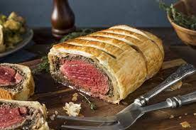 Delicious beef wellington with flaky pastry, showcasing the tender beef filet inside.