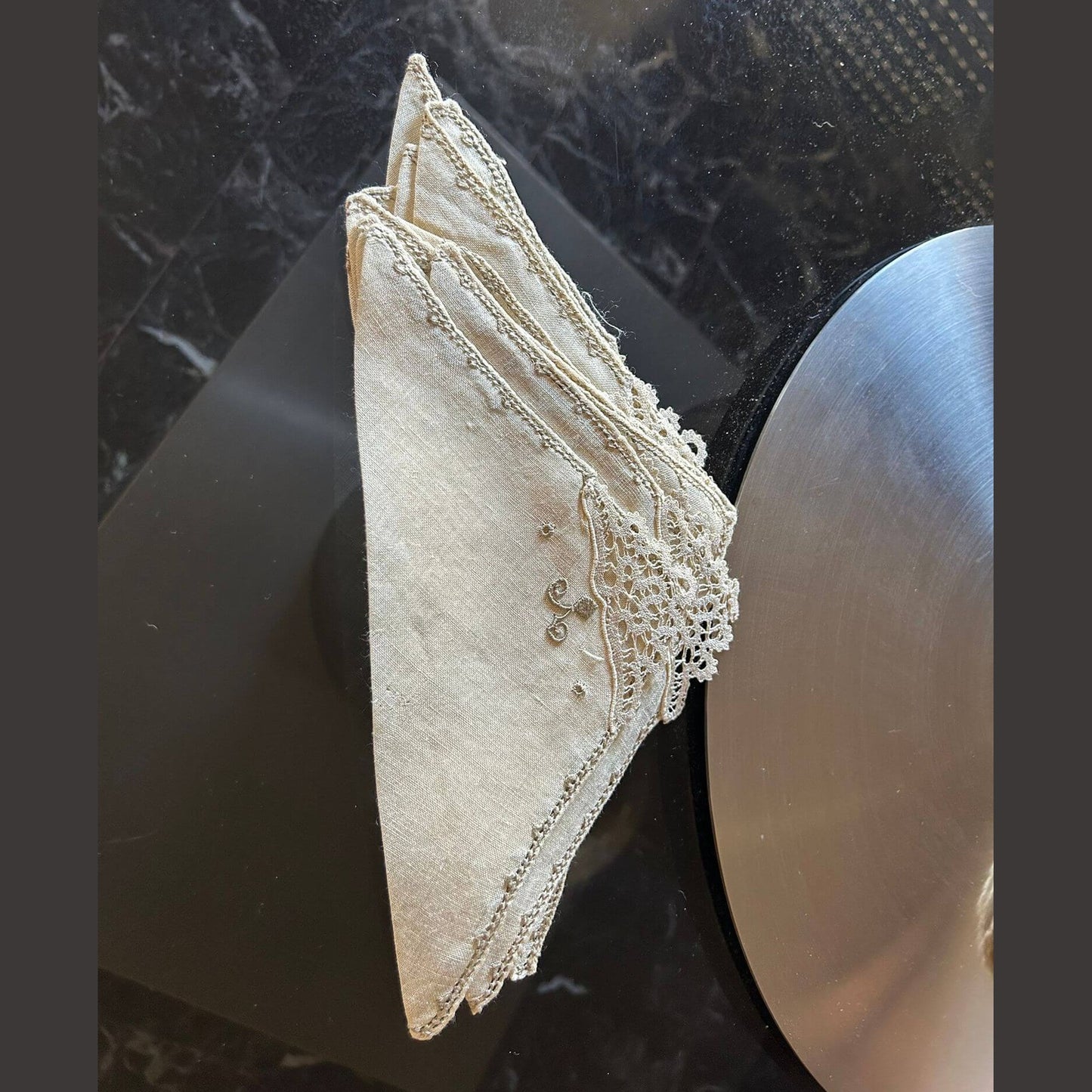 Elegant Burano lace napkins, handcrafted, perfect for special events, showcasing intricate details and vintage charm.