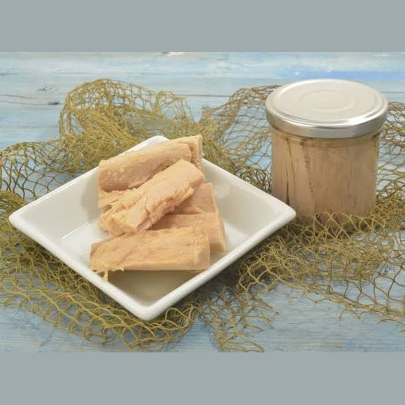 Filetti di Tonno Calabrese in olio d'oliva su piatto con vaso di vetro da 200 gr.
