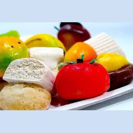 Colorful assortment of Sicilian Martorana fruit sweets, showcasing intricate almond-based desserts.