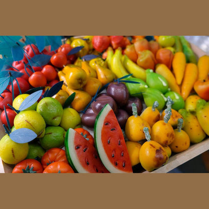 Colorful assortment of Sicilian Martorana fruits, including watermelons, bananas, and other vibrant sweets.