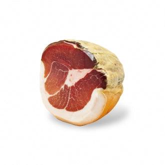 Culaccia di Modena, traditional Italian cured meat, showcasing rich marbling and natural seasoning.