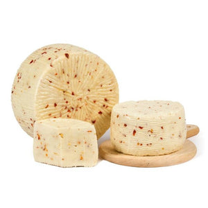 Formaggio di Pecora al Peperoncino: Sicilian cheese with chili pepper featuring a smooth texture and spicy flavor.