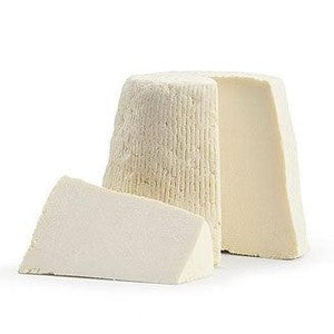 Ricotta Stagionata Salata blocks showing the traditional salted cheese made from sheep's milk.